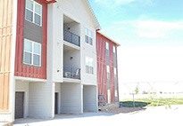 An exterior view of a Journey Homes apartment building showcasing the use of the Nystrom product, Renovation Nosing with EcoTread.